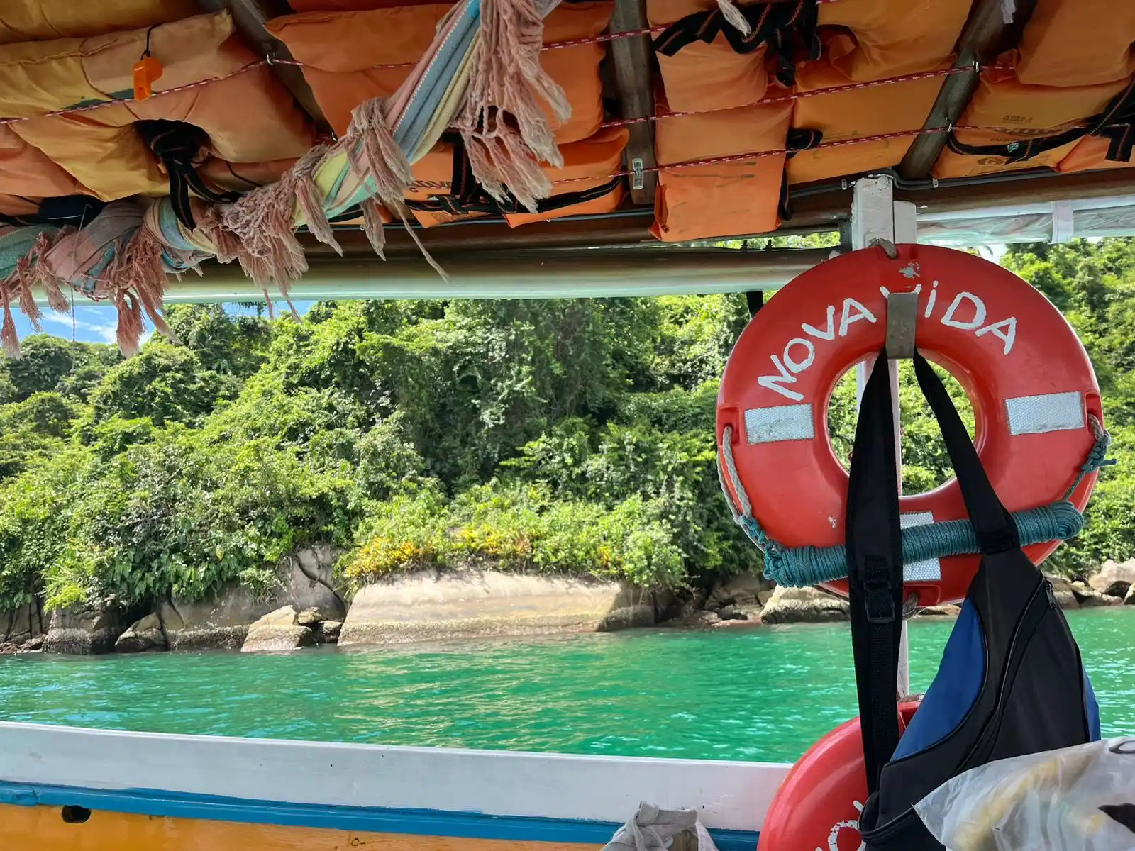 Tropical island viewed from a boat called 'Nova Vida'